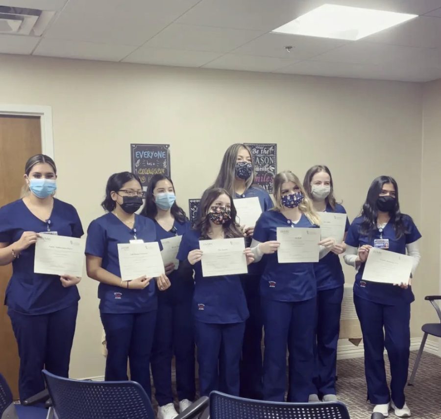 Eight seniors receive their Certified Nursing Assistant certificates. 