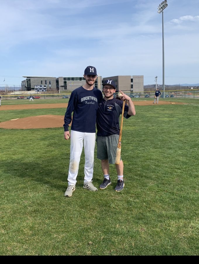 JV baseball coaches Jackson Hook and Owen Stewart pose together before the start of practice. 