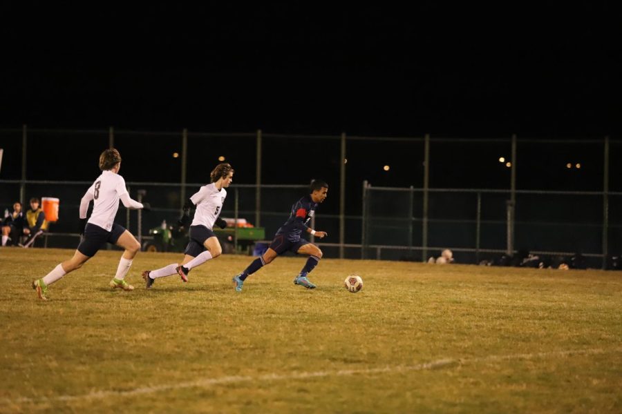 Sophomore Isai Rodriguez dribbles the ball towards the goal.