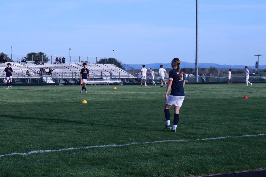 Freshman Miguel Osorto (left) and Junior Braeden McGrath (right) warming up together. 
