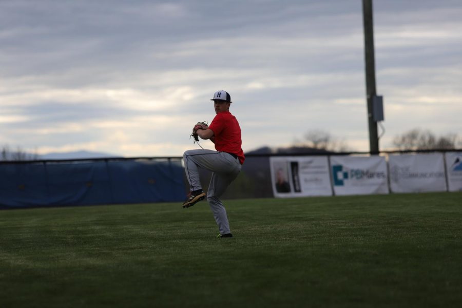 Senior pitcher Evan Bert warms up prior to the game. 