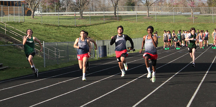 (Left to right) senior Luis Cedeno Homs, sophomore Caleb Lemus Portillo , and junior Zachary James sprint in the 100m dash.