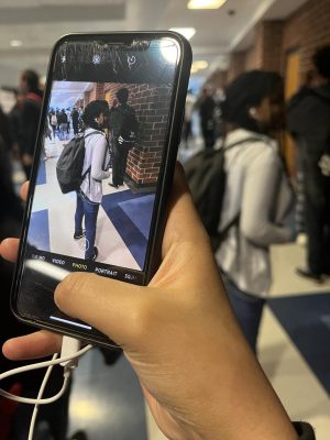 Student takes a picture of another student to tag them in Phone Tag.