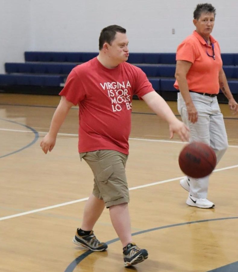 Senior Donnie Casey practices with coach and special education teacher Susie Bocock. The team prepares for their jamboree Monday, May 16.