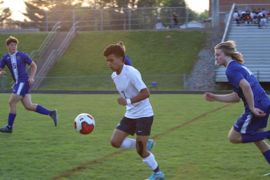 Sophomore Isai Rodriguez chases down ball past a Rockbridge defender. 