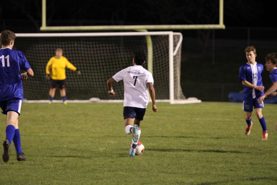 Sophomore Isai Rodriguez dribbles through open space.