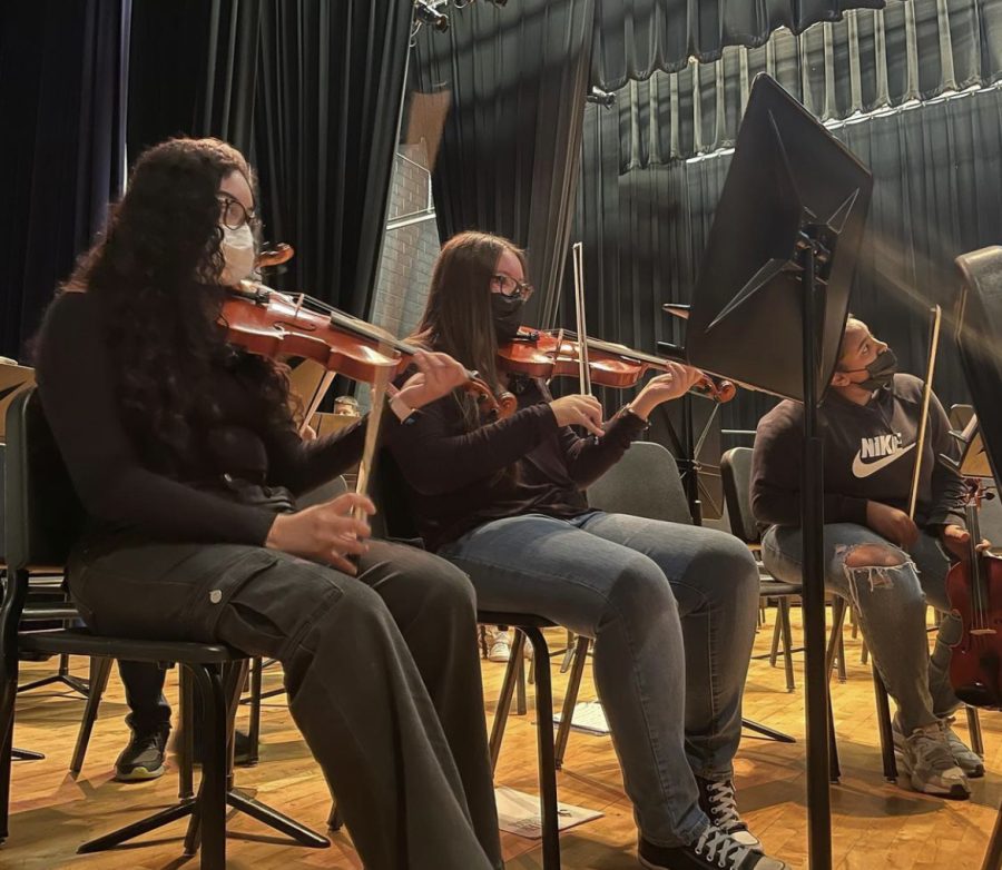 Freshman Angely Lopez warms up for her spring concert that includes all public city schools. She plays the violin in band and has been playing for seven years. I feel like [the] violin is a part of who I am. At first, I didnt like it but I cant imagine quitting, Lopez said. 