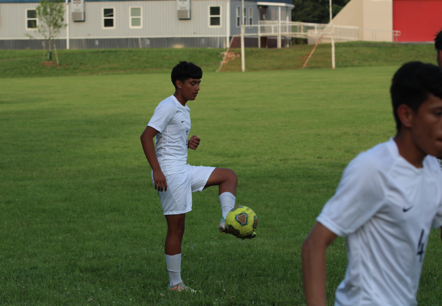 Sophomore Brian Antinez warms up for his first varsity game.