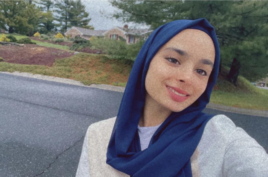 Junior Fatimah Salman poses for a photo outside of her home.