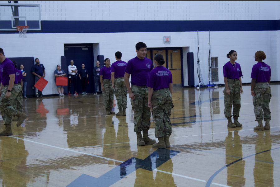 JROTC members team up into two to continue their performance. 