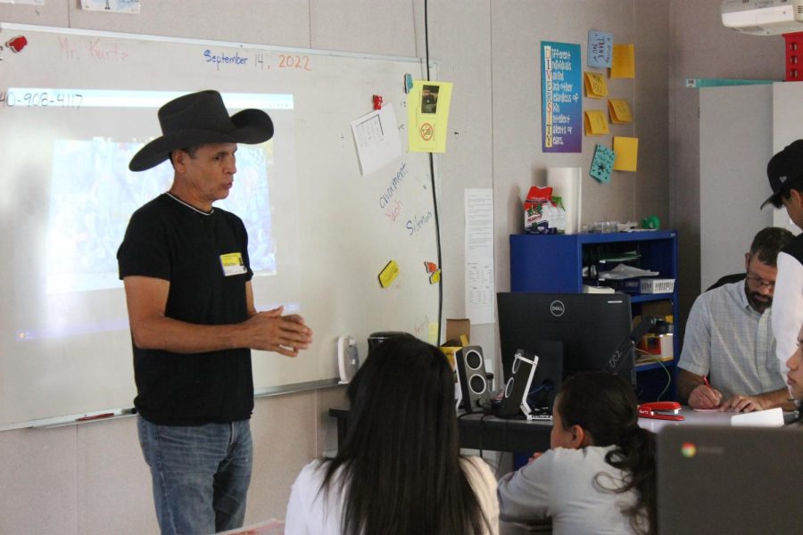 Roberto Marquez answers questions students in an ESL class have about his documentary and journey with art.
