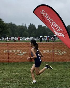 Freshman Lya Hurst runs during a Cross Country meet.