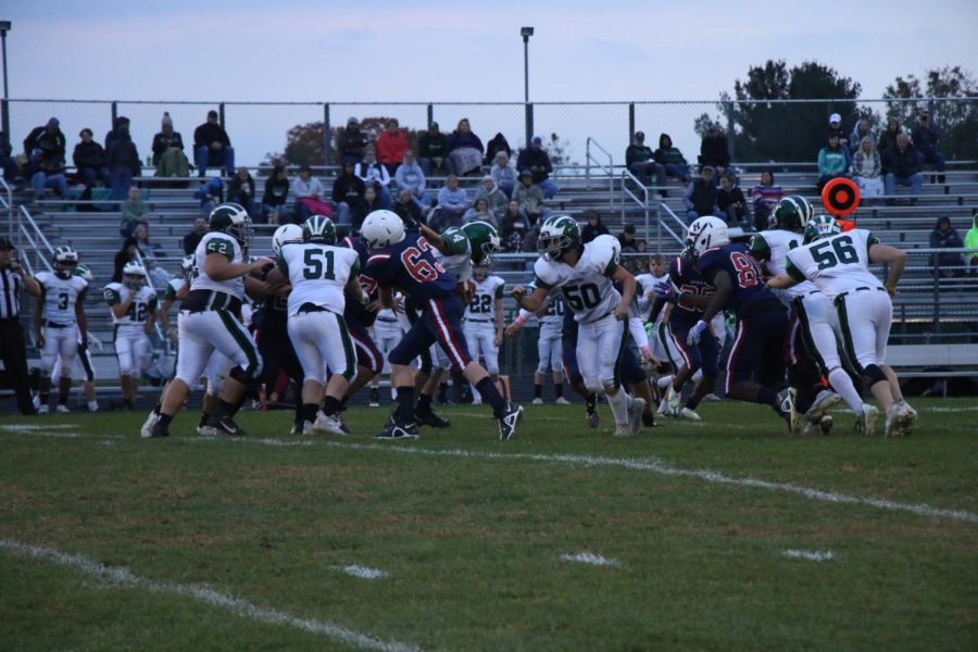 Number 63 brings the opposition Quaterback down.