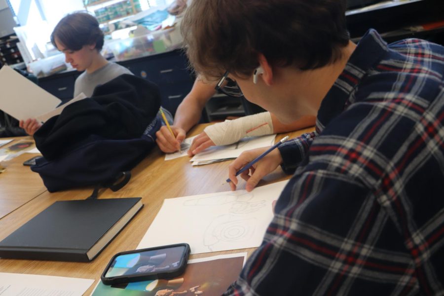 Finn Bell
11th grade
Finn Bell is working on a Still Life assignment. “We are working on Still Life in three stages. The one I would like to work on is surrealism, but this in front of me is realism. I enjoy dream-like art,” Bell said.