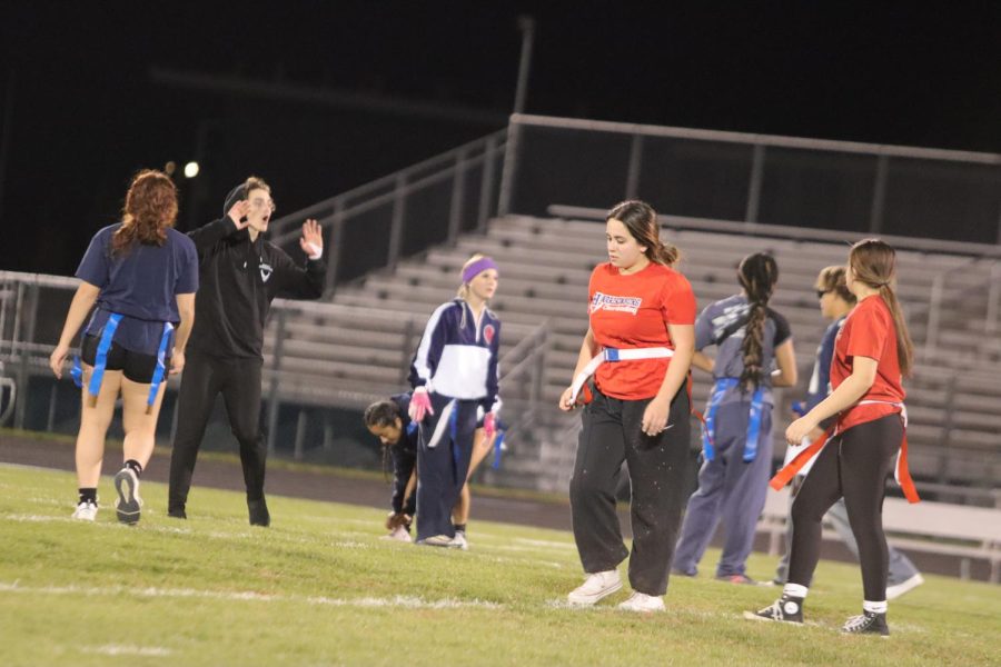 Junior Alice Wightman walks back to her position after seniors score a point. She has watched the annual powderpuff games since her freshman year. 