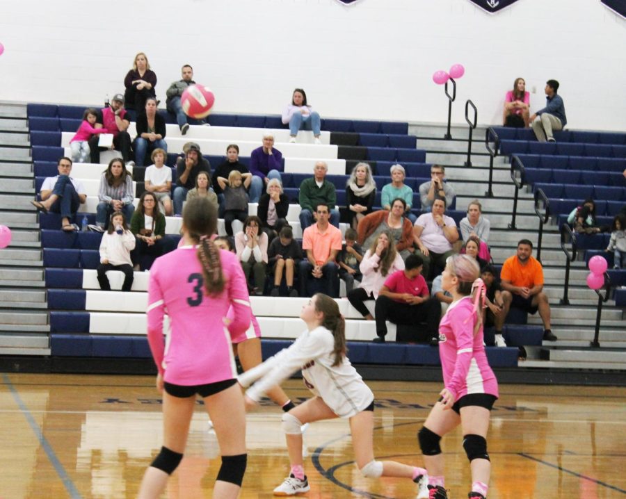 Eighth grade Finnly Miller gets ready to pass the ball to the setter.