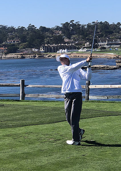 Corriston watches his shot on hole seven at Pebble Beach.