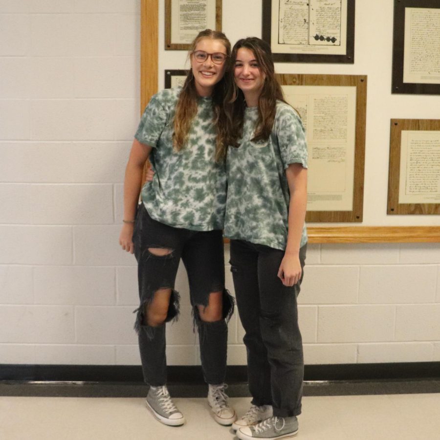 Juniors Marin Sikes (left) and Delaney Shaver (right) twin and even switch their shoes. 