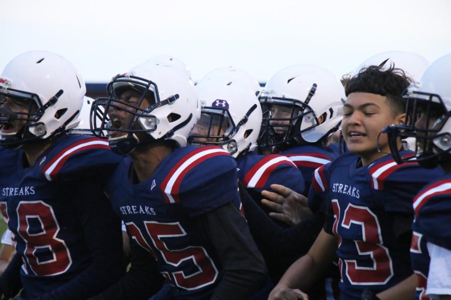 Eighth grader Ayden Groden celebrates a touchdown.