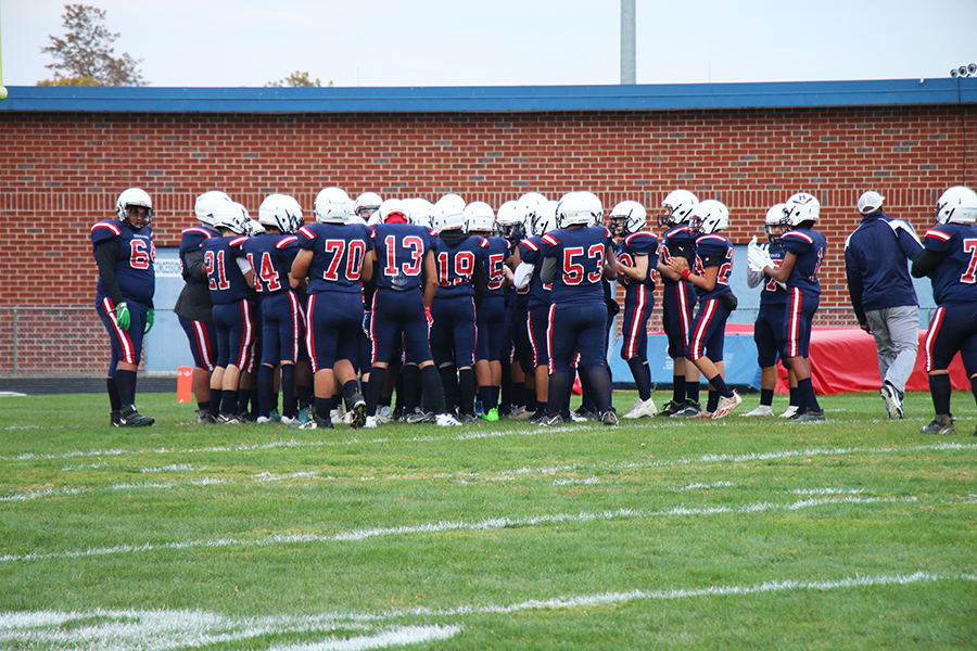 The team huddles up to discuss game plan before the game. 