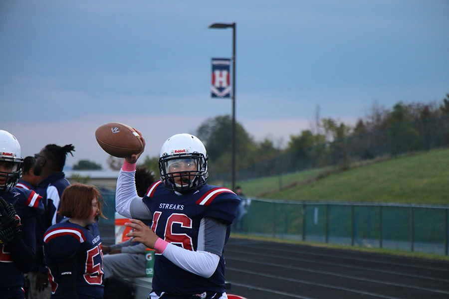 Eighth grader Yandel Robles warms up.