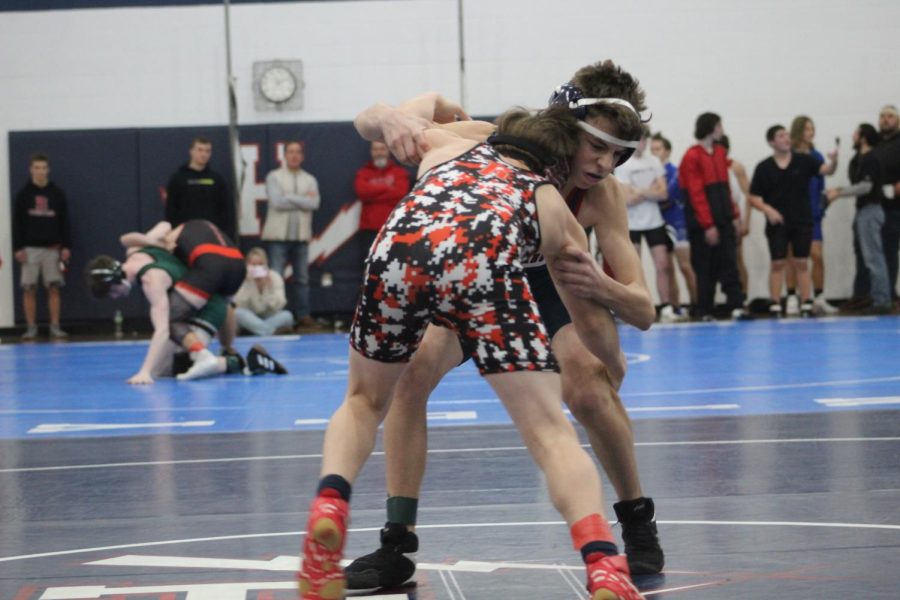 Sophomore Louis Gibson faces first opponent in their first wrestling invetational of the season. 
