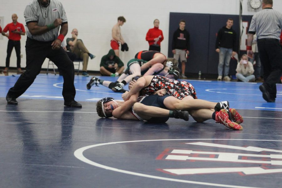 Sophomore Louis Gibson fights to get out from his opponent. 