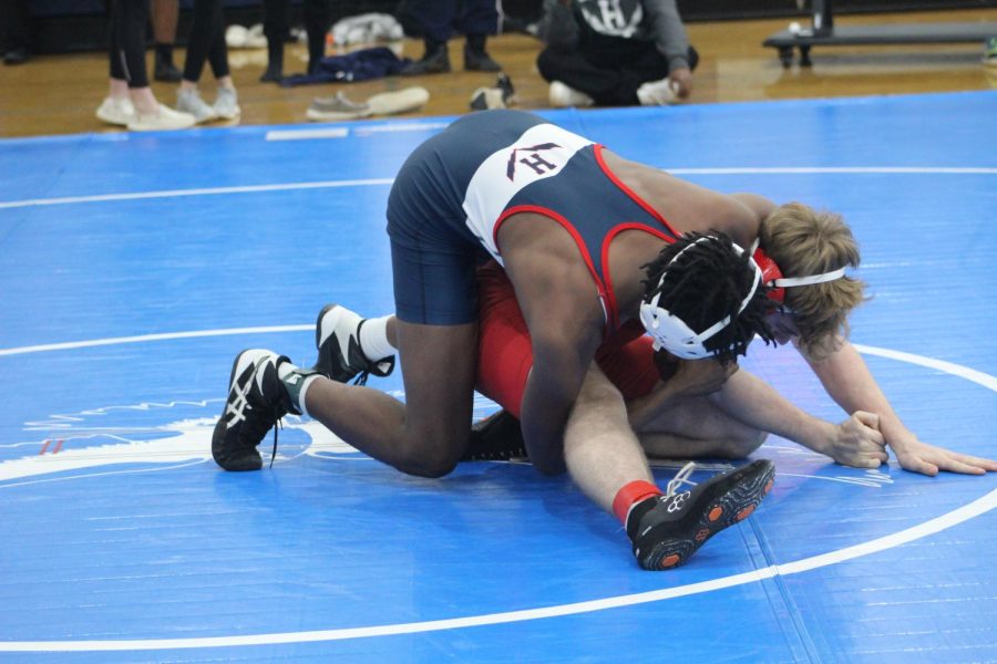 Junior Rashad Parham pins his opponent at the first home wrestling invetional. 