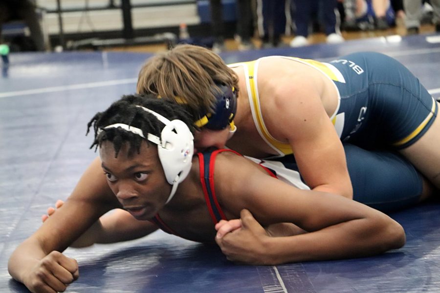 Junior Rashad Parham tries to escape his opponent from Christiansburg High School. 