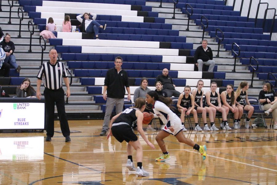 Eighth grader Sheffey Alyse gets through the opponent teams defence 