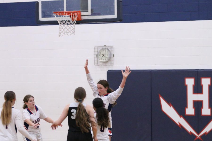 Eighth grader Weakley Addison gets help from eighth grader Cain Sierra and together they make the shot.