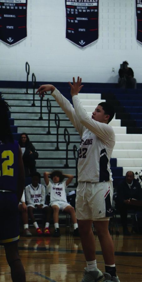 Eighth grader Yandel Robles shoots free throw against Patrick Henry. Hes a forward. 
