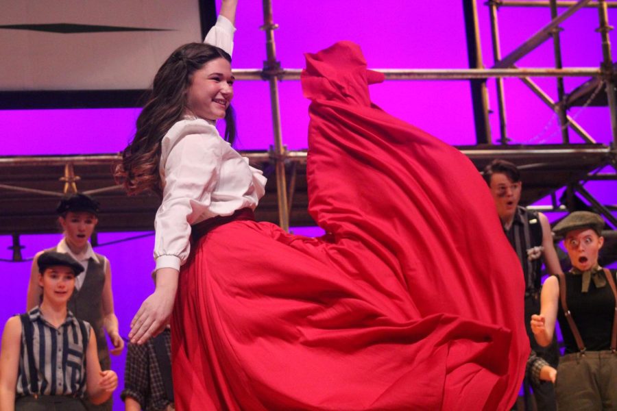 Senior Ella Young dances during the song 'King of New York' and was cheered on by the newsies surrounding her. 