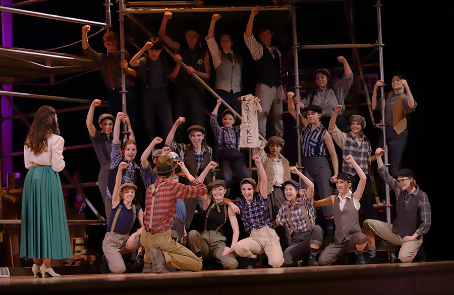 The Manhattan Newsies pose for a picture during the Seize the Day number.