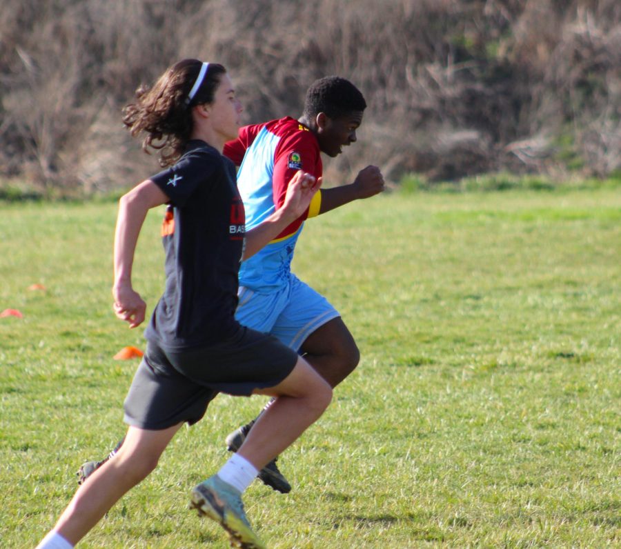 8th grader JJ Walters and freshman Eritier Eca do a sprinting/endurance drill during their practice. 
