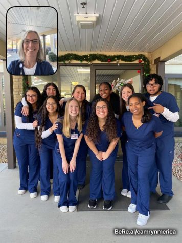 The students of the first semester Nurse Aide program smile for a BeReal with teacher Tricia Cummings.