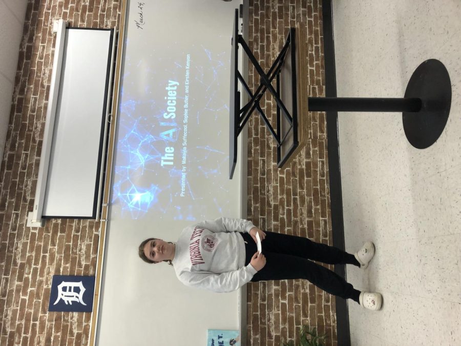 Kirsten Kenyon presents her group's designed utopia in Holli Wolter's English 9 Honors class.