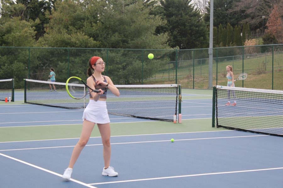 Junior Jade Chao practices with the girls tennis team. 