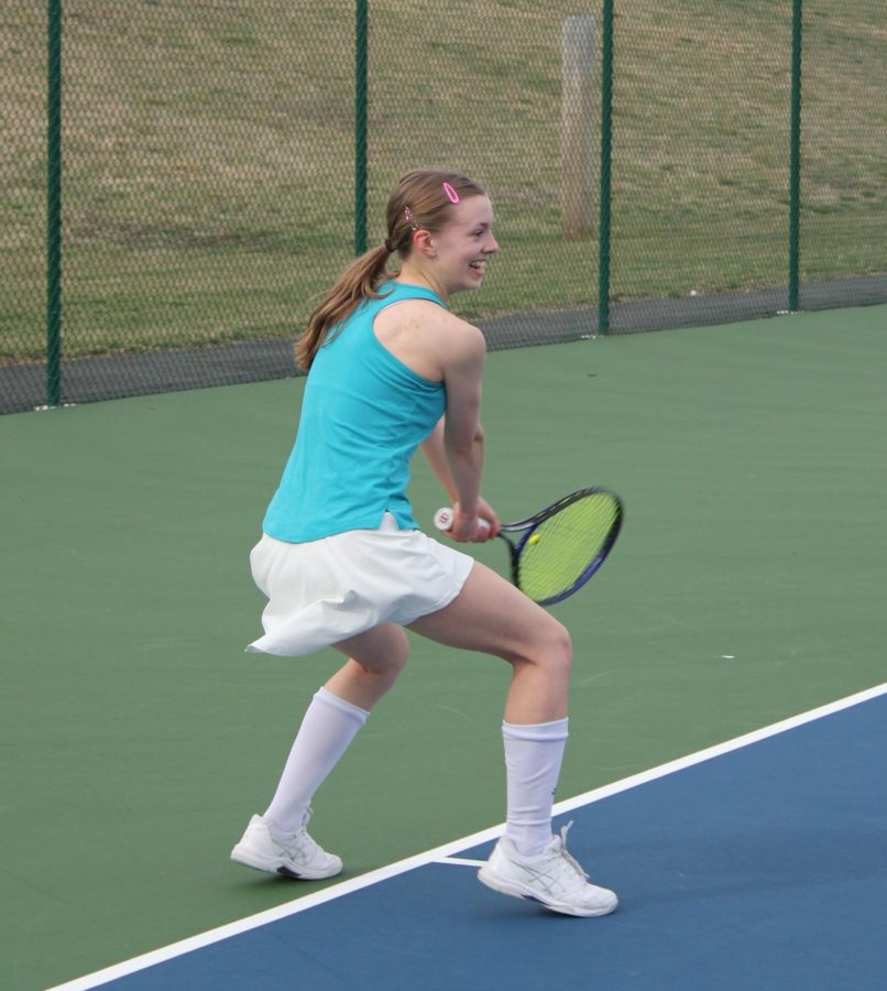 Junior Natalie Corso practices doubles. 