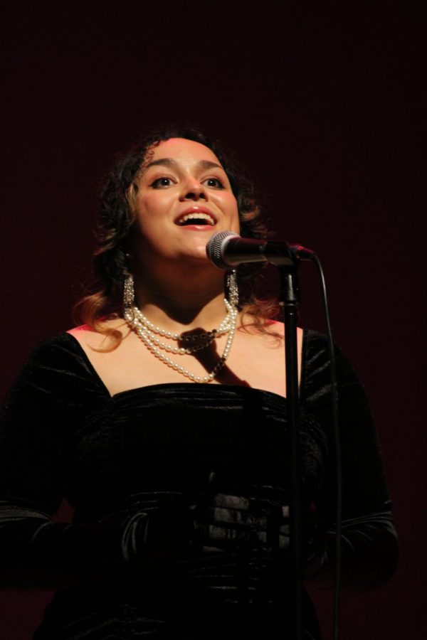 Senior Nina Alabanza sings a famous song by the Fugees for the Black Student Union talent show, March 3.