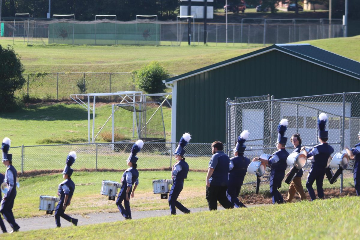 The Blue Streak bands heads down the walkway to get ready to perform their show