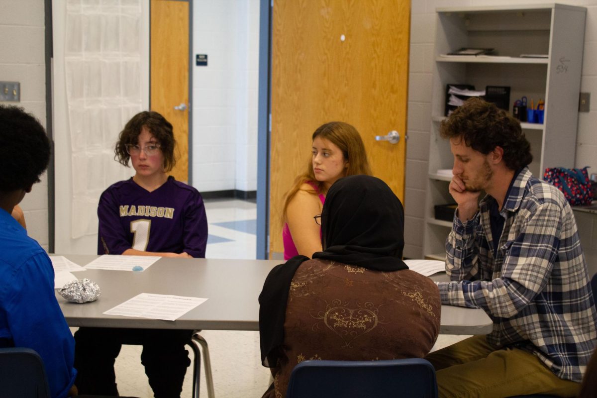 Mr. Crigger and his forensics group talking about different categories for forensics 