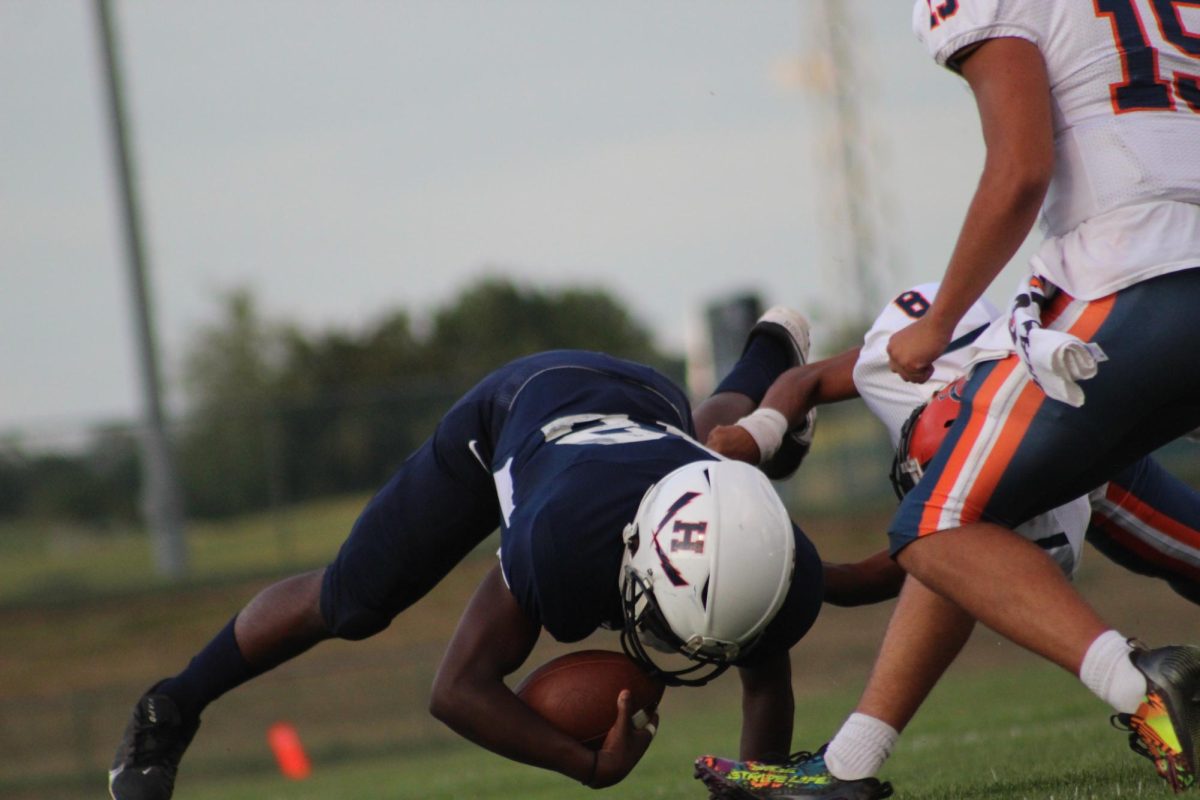 Sophomore Antonio Petty dives with the ball to gain yards. 