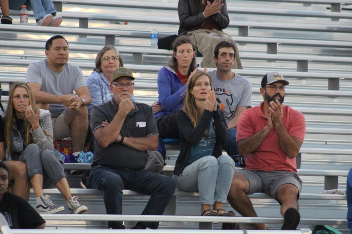 Harrisonburg Parents cheer from the stands.