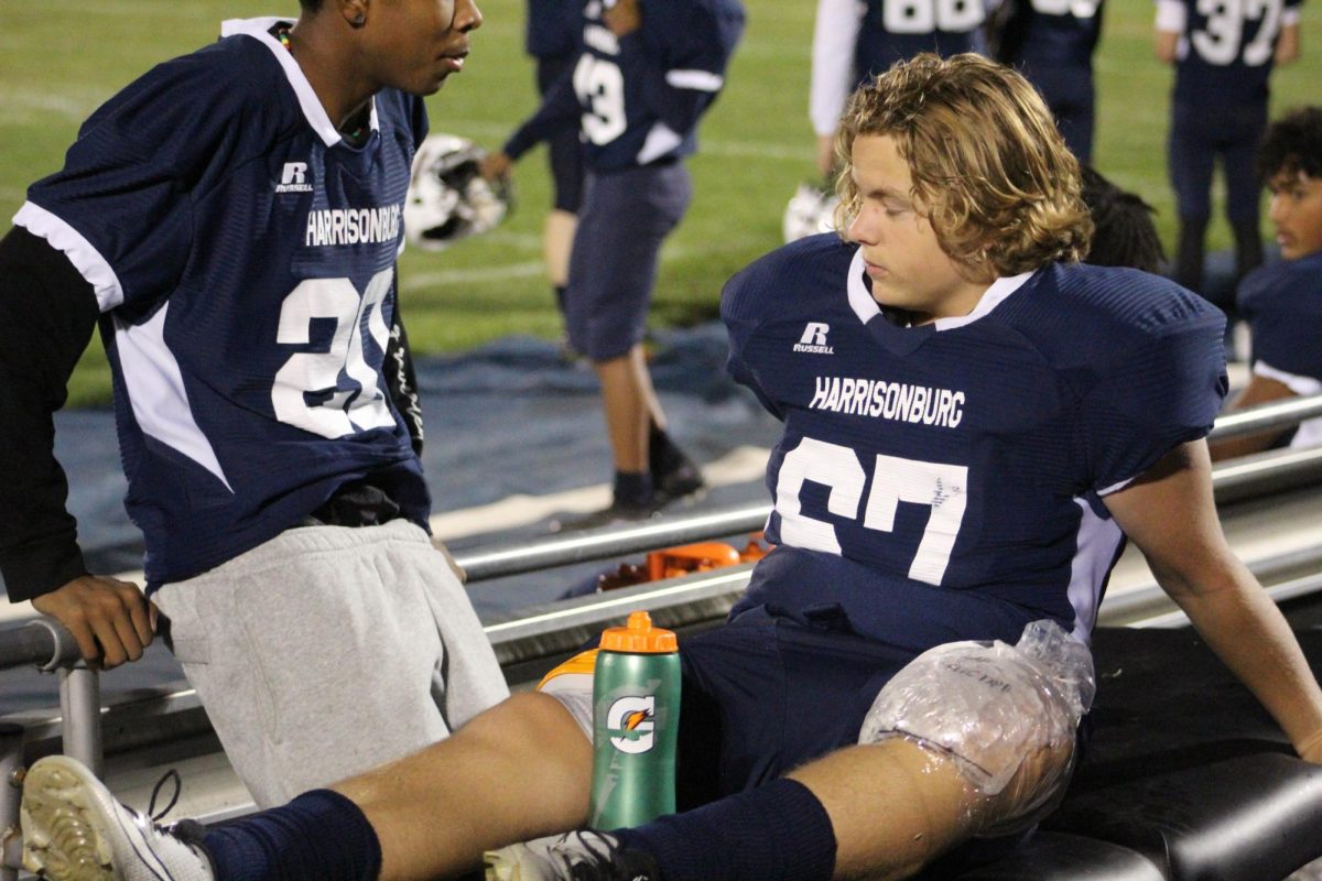 8th grader Reuben Miller ices his knee after being removed from the game due to an injury.