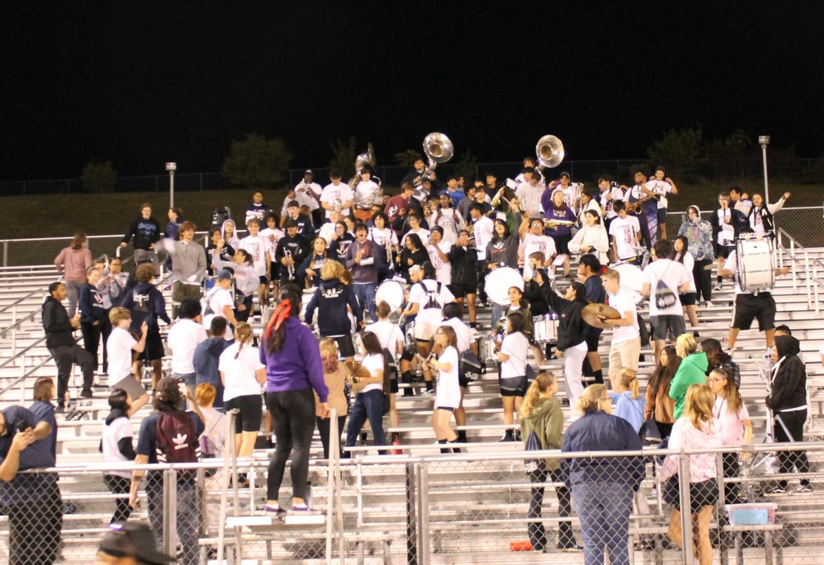 The marching band plays the HHS fight song after victory over Eastrock Sept. 22. They didn’t stop playing when the game finished, they played a good bit afterwards. “We were having so much fun playing, so we decided to play extra,” Sophomore Billy Peritt. 
