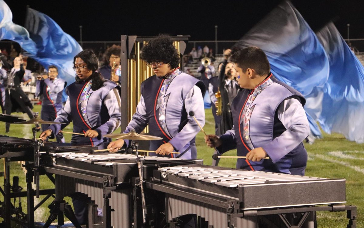 Percussionists from the band play the marimba during the halftime show.