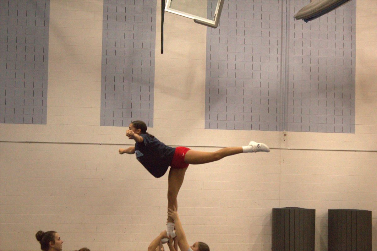8th grader Chazlyn Hoover practices for arabesque at an extension.