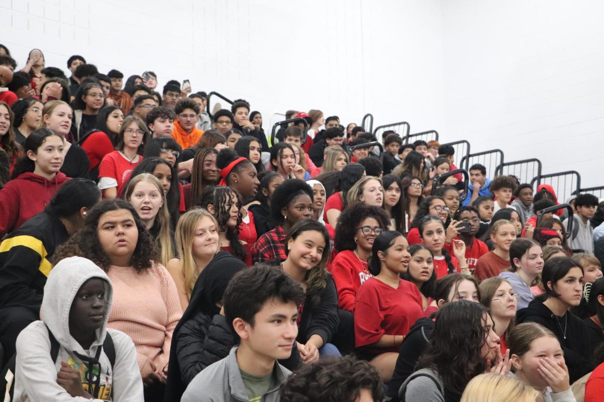 The sophomore class dresses in red as part of the color wars theme for the final day of spirit week. Freshman wore black, sophomores red, juniors blue and seniors white.