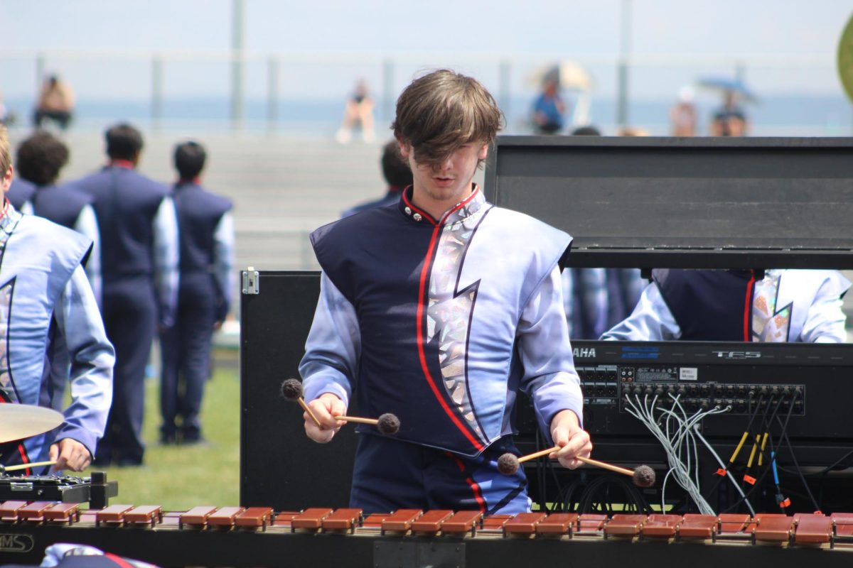 Senior Eamon Morrow plays xylophone during half time performance.